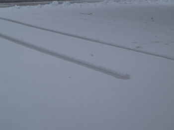 Tire ruts show how deep the snow is.
