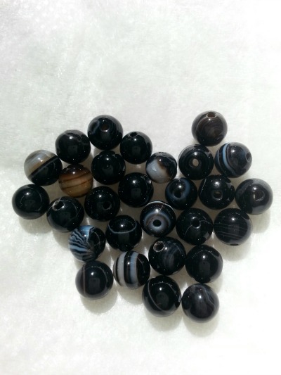 Round, 6 mm Onyx beads. Look at all the variety in shading!